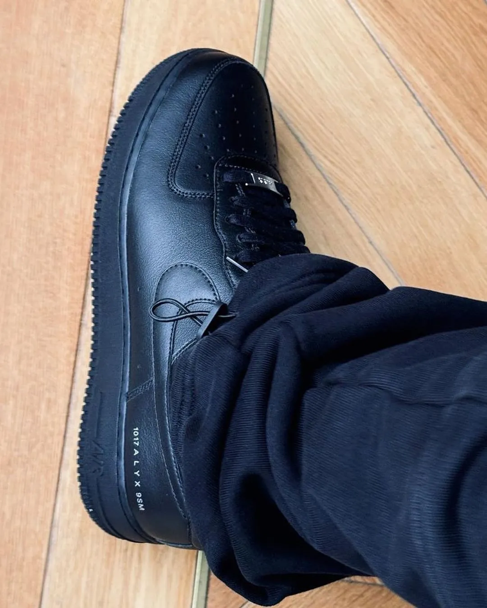 Matthew M. Williams' Nike Air Force 1 Low black color on feet